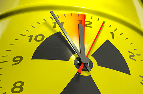 A nuclear countdown clock superimposed on a yellow barrel