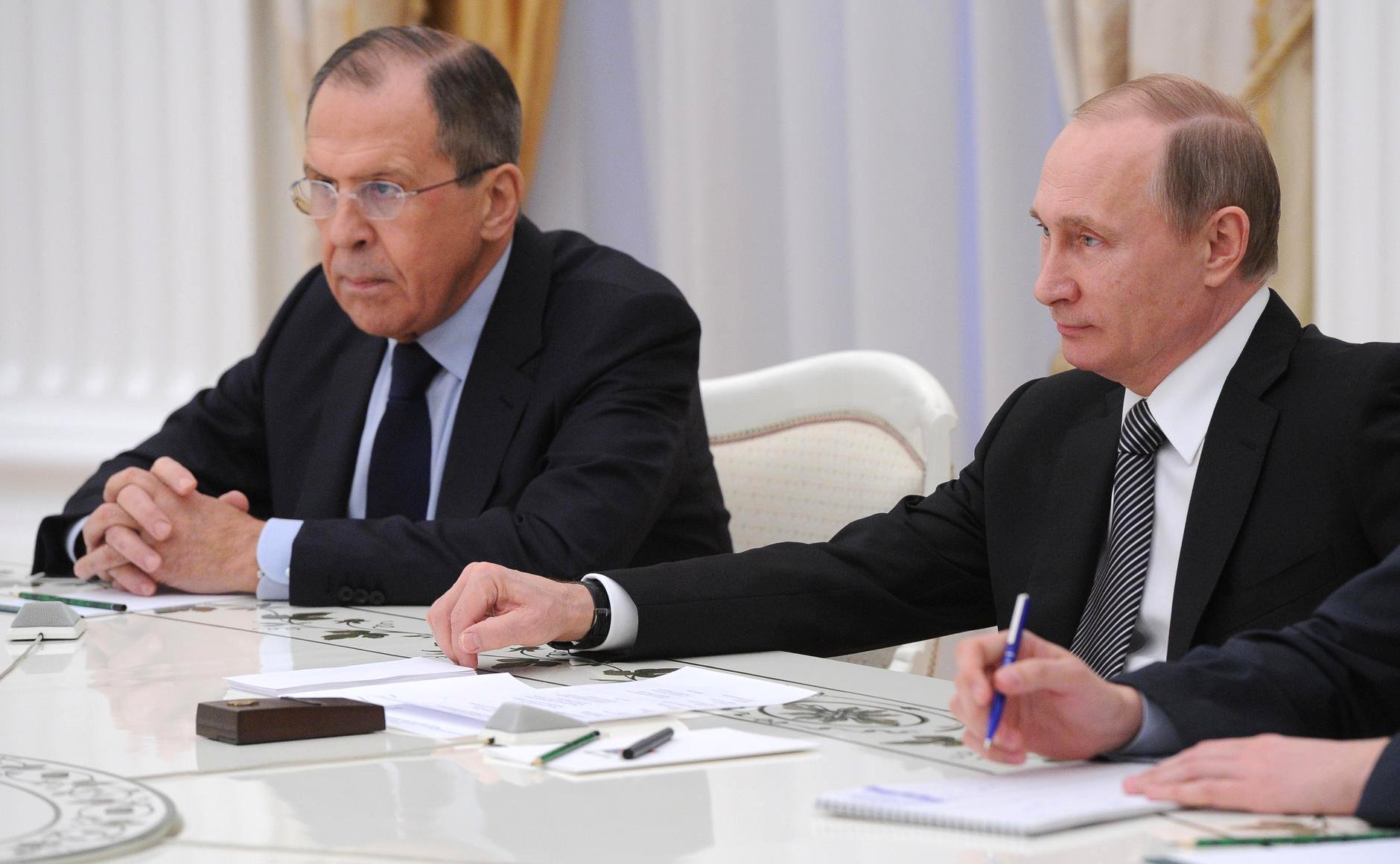 Russian Foreign Minister Sergey Lavrov (left) and President Vladimir Putin in a 2015 meeting with Iranian officials in Moscow.